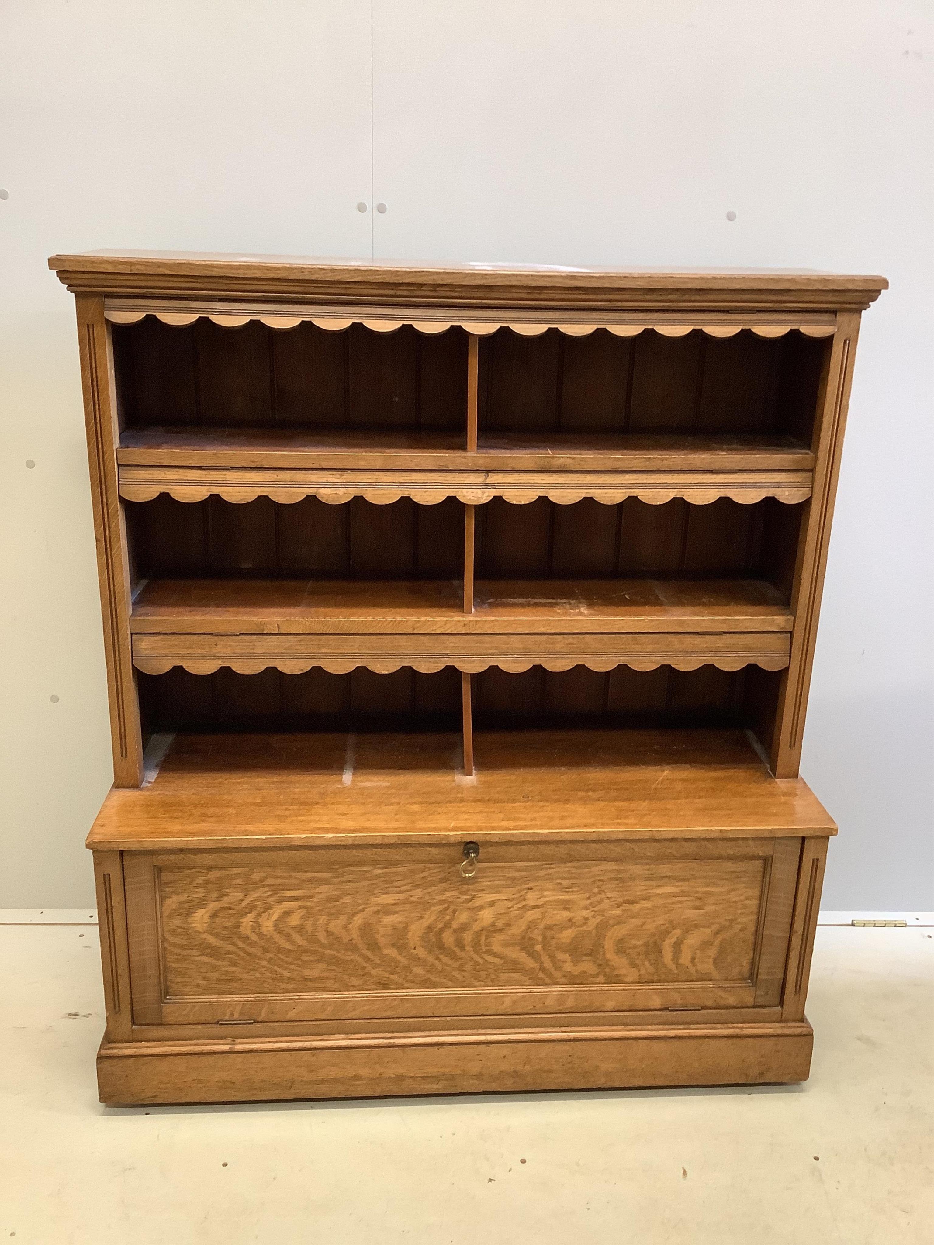 An Edwardian oak bookcase, width 108cm, depth 42cm, height 124cm. Condition - fair